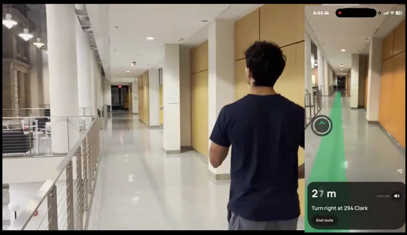 A person walking a hallway with an AR route on a phone screen